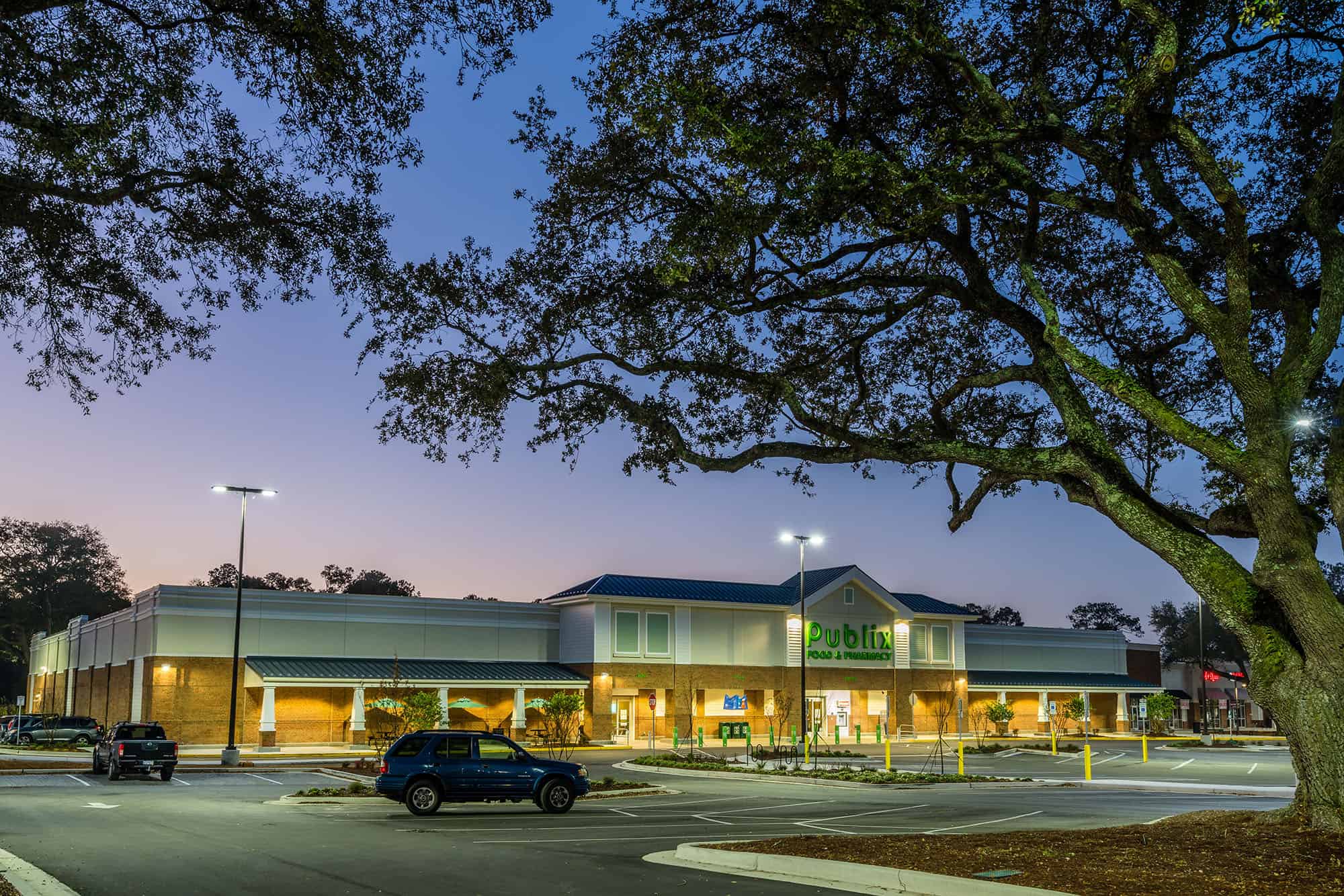Evening view with natural Live Oak trees of Publix.